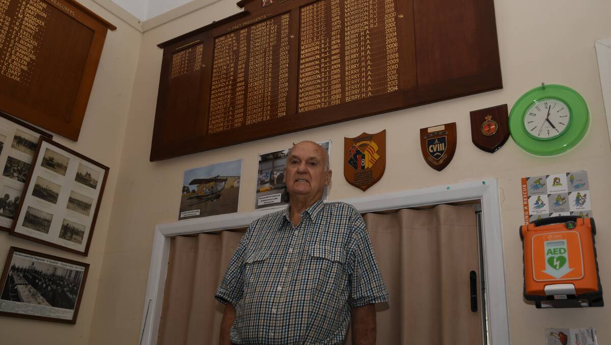 HERITAGE: Nhill RSL president Henry Berry stands in front of the board of past presidents. Picture: ALEX DALZIEL
