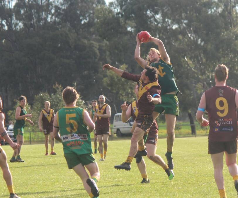RISE UP: Josh Fowkes gets up for a big mark in the seniors. Picture: CONTRIBUTED 