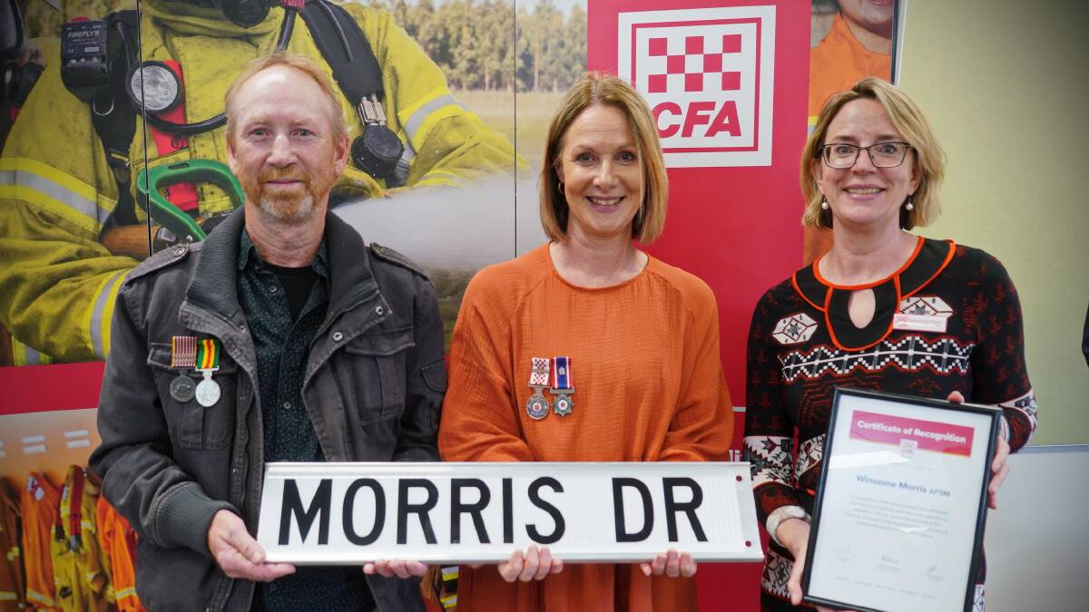 AWARD: Winsome Morris' family members Brett Morris and Sue Honeyman receive her award presented by CFA chief executive Natalie MacDonald. Picture: CONTRIBUTED