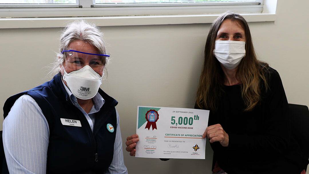 5000: Stawell Regional Health's Helen Kennedy with Brooke Borch who received the 5000th COVID vaccination dose delivered by SRH. Picture: TALLIS MILES