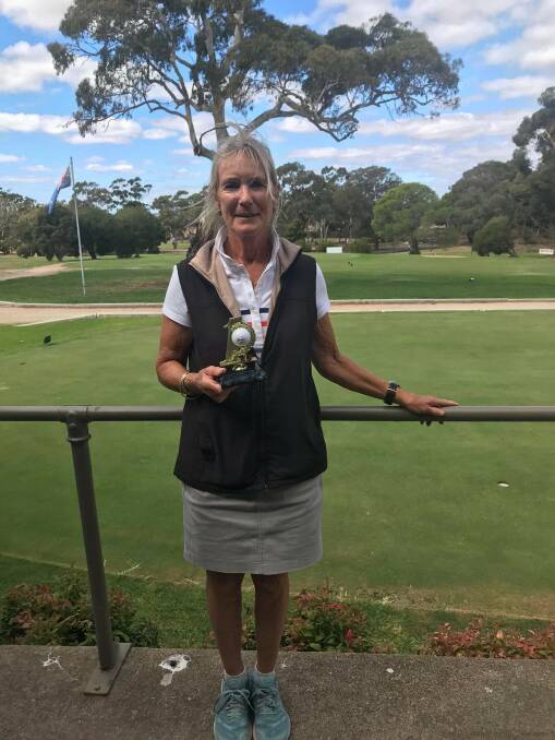 LUCKY SHOT: Julie Dunn with her hole in one trophy. Picture: Contributed. 