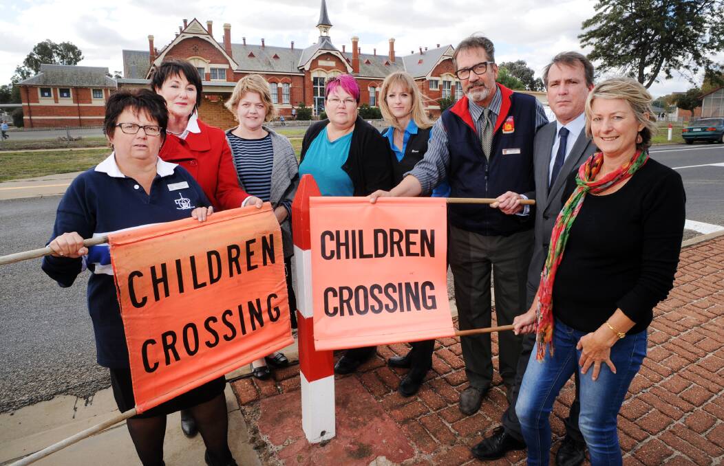 PROTEST: Stawell school principals and school council members Robyn Jones, Kate Harney, Helen Giles, Lindy Chester, Trish Kennedy, Nick Lynch, Jim O'Brien and Karen Hyslop. Picture: PAUL CARRACHER 