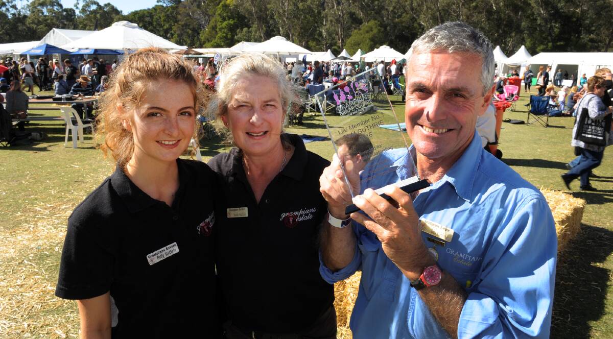 HONOUR: Polly, Sarah and Tom Guthrie at the Grampians Grape Escape on Saturday. Mr Guthrie was made the first life member of the event. Picture: PAUL CARRACHER