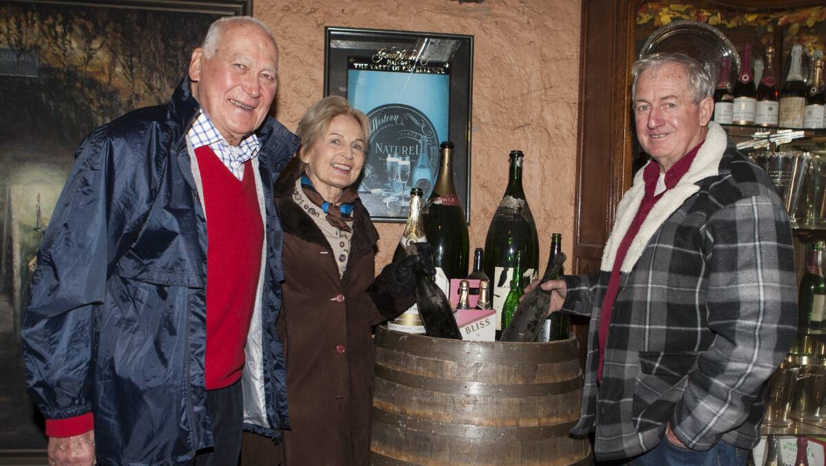 TOAST: Reg Mowatt, Anne Bourne and Glen Hurley relive old memories at Seppelt in Great Western. Picture: PETER PICKERING