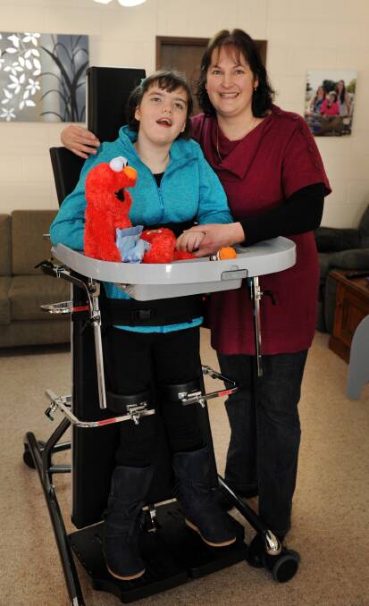 ALL SMILES: Tania Moss tries out the new stand-up frame with her mother Karen on Wednesday. Picture: PAUL CARRACHER