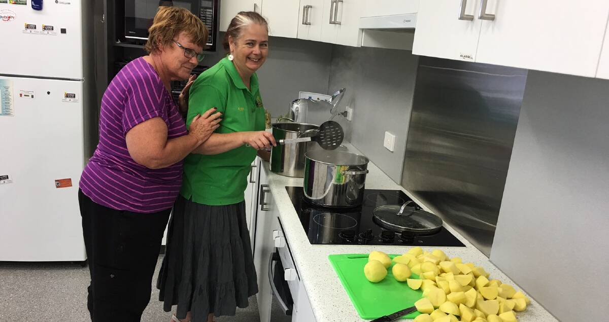 READY, STEADY, COOK: Alison Bainbridge and Jenny Dunn prepare for the Stawell Neighbourhood House community lunch on May 4. Picture: CONTRIBUTED 