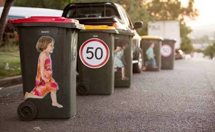 The Life Saving sticker on wheelie bins.