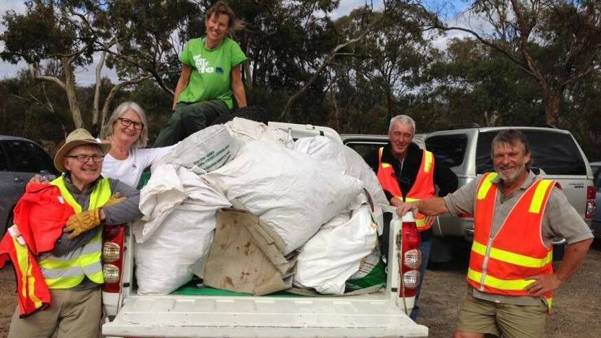 Stawell Urban Landcare members Peter Barham, Penny Earle, Julie Andrew, Mick Monaghan and John Pye with rubbish collected from a highway working bee earlier this month.
