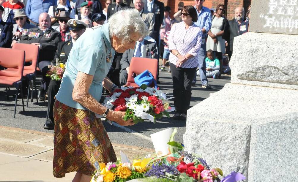 COMMEMORATION: Elva Raggatt prepares to lay a wreath at the cenotaph during the Anzac Day service on behalf of members of Stawell Red Cross.