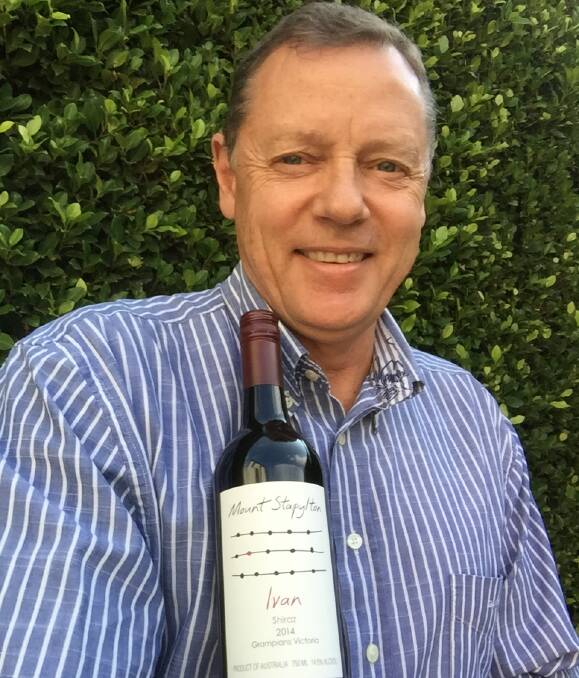 FINE WINE: Mount Stapylton Wines owner Howard Staehr with a bottle of his 2014 Ivan Shiraz which will be released at a dinner in Halls Gap. Picture: CONTRIBUTED