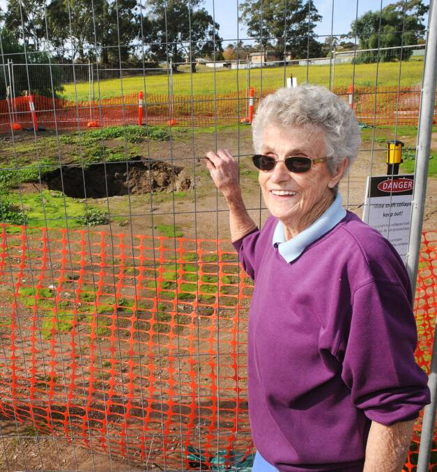 GREAT BIG HOLE: Norma McIntyre, 91, has a collapsed mine shaft behind her Stawell home. Picture: PAUL CARRACHER