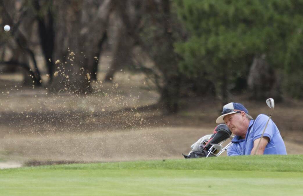 SWEET STRIKE: Robert Harricks blasts a ball out of a bunker at Chalambar Golf Club back in February when the weather was warm. Picture: FILE SHOT