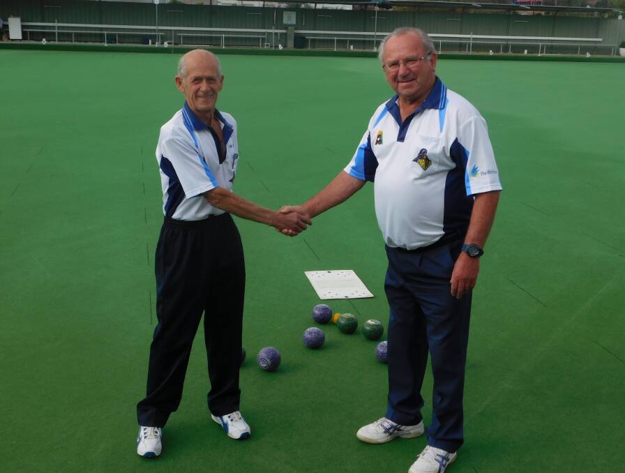 Norm Tiley (left), pictured with 2015-16 single champion Ken Hinchliffe, has been elected re-elected VRI Bowls Club president for another year.  