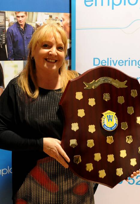 Honoured: Stawell Warriors president Debbie Bach accepts the Club Champions shield at the Wimmera League vote count on Monday night. Pictures: Sam Camarri