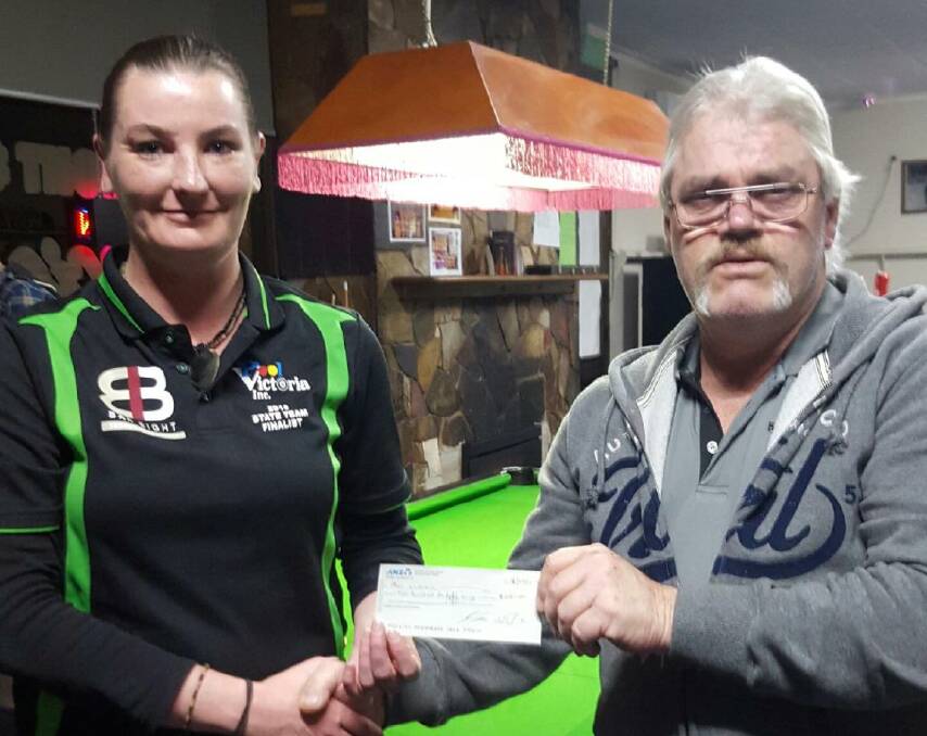 Sponorship: Jacinta McMaster accepts a $200 cheque from Stawell Eight Ball president Ian Walton for expenses while she represents Victoria.