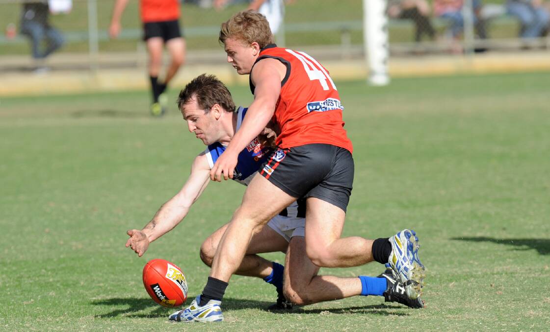 Big Bump: Robert Armstrong does his best to bump his Minyip-Murtoa opponent off the ball last weekend. Picture: PAUL CARRACHER