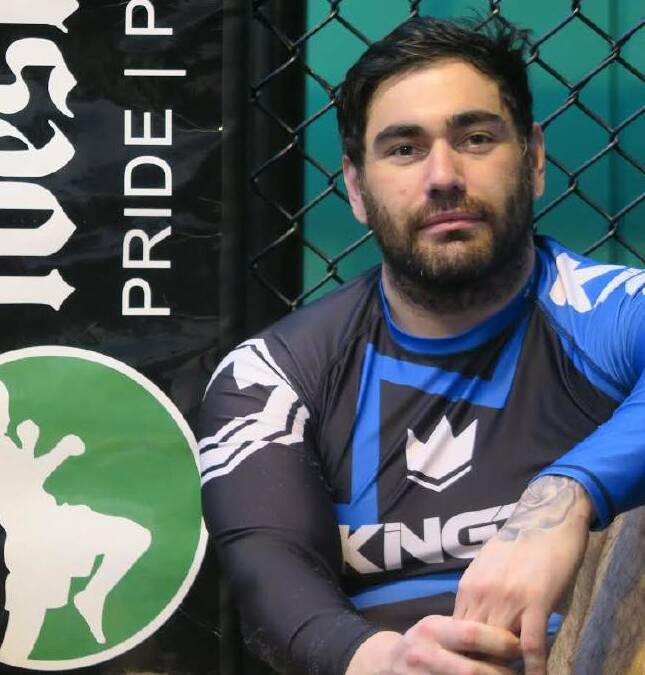 Getting ready: Jeremy Joiner sits beside the cage at his training base, Westside MMA, in the week's leading up to his next fight.