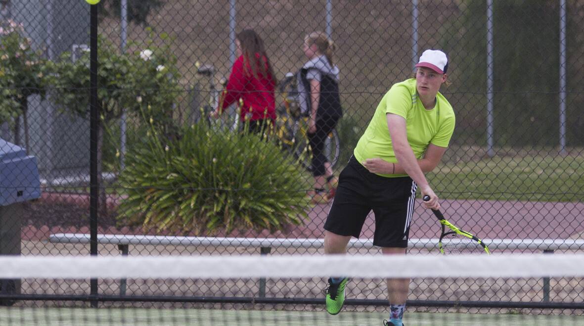 Big Serve: Stawell youngster Blair Clayton sends down a big serve during the Stawell Tennis Club Friday night competition. Picture: Peter Pickering. 