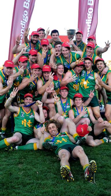 Premiers: Navarre Grasshoppers players celebrate their third consecutive premiership in the Maryborough Castlemaine District Football League. Picture: MARK MCMILLAN
