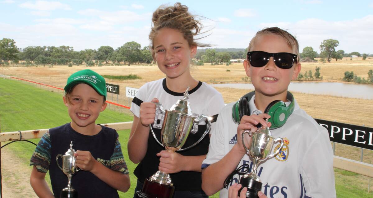 Giveaways: Sebastian, Tiarna and Brayden Barry show off sunglasses, a hat and head phones supplied by Country Racing ahead of the Great Western Cup. Picture: Peter Pickering
