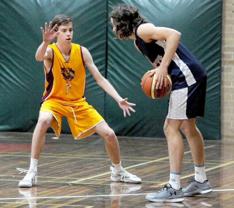 DEFENCE: Stawell's Sam Cronin stays in his defence stance while defending the perimeter against Hornets.