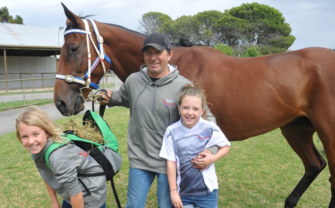 All in: Stawell's Dane Smith and his children Judd and Jade are hopeful Something To Share can win the Great Western Cup. Picture: Grace Bibby
