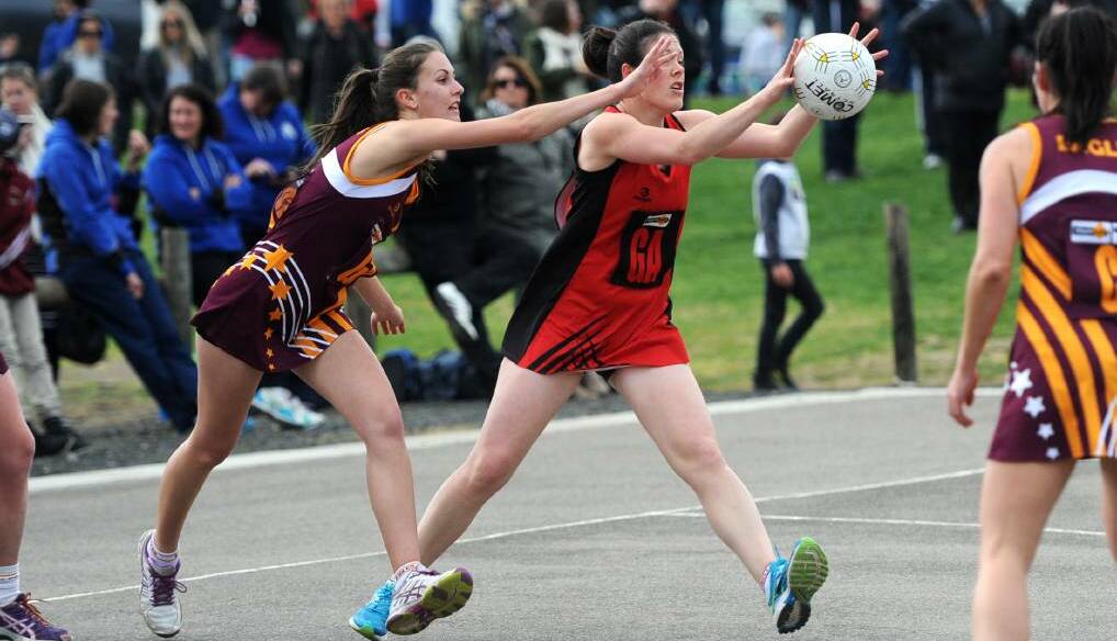 CLOSE CALL: Kiani Stewart of Warrack Eagles does her best to intercept a pass made to Stawell Warriors goal attack Jemma Clarkson during the first semi final played at Dimboola. Picture: Sam Camarri