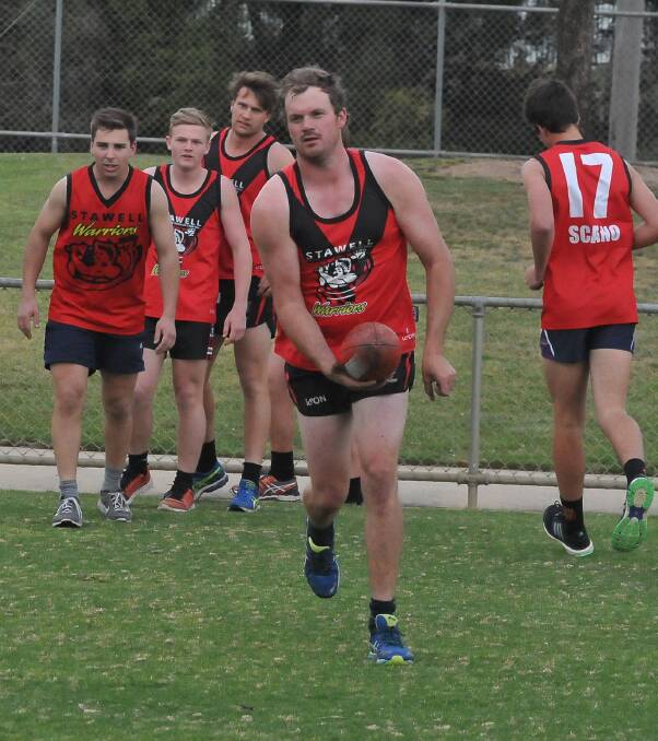 Leading the way: James Delahunty leads a drill at the first pre season session on Wednesday night. The Warriors spent time doing balls drills and running. Pictures: Mark McMillan