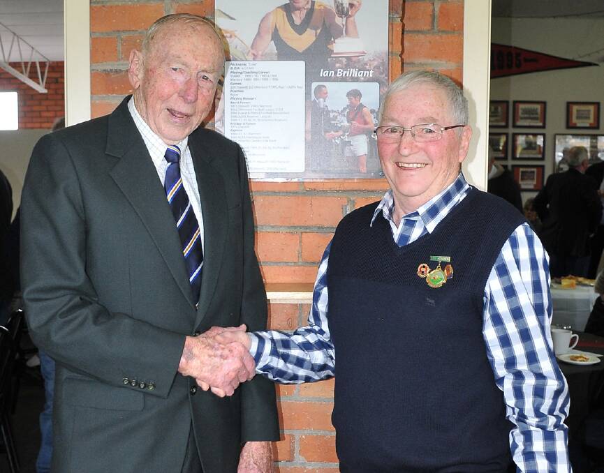 HAND SHAKE: John Kennedy senior with newly inducted Stawell Warriors Football Club legend Ian 'Ernie' Brilliant. Picture: MARK MCMILLAN
