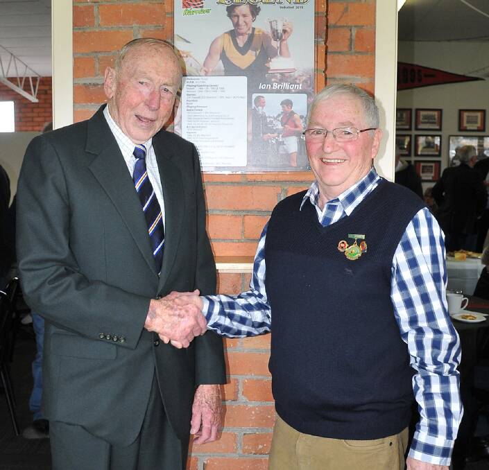 Congratulations: John Kennedy Snr shakes hands with newly inducted legend of the Stawell Warriors Football Club Ian 'Ernie' Brilliant. Picture: Mark McMillan