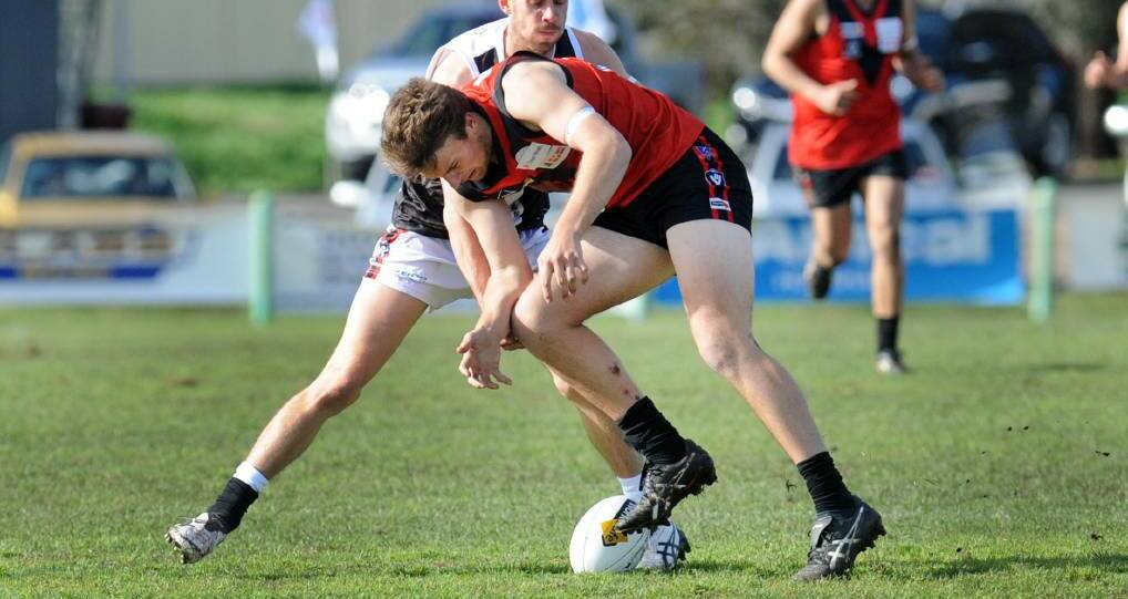 LOOSE BALL: Stawell Warrior Liam Scott braces for contact as he looks to pick up a loose ball in Stawell's loss to Horsham Saints last Saturday. Picture: PAUL CARRACHER