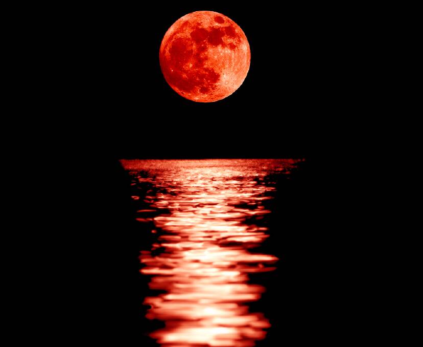 Full red moon with reflection closeup showing the details of the lunar surface. As seen from Varna, Bulgaria. Photo: Stanimir G.Stoev