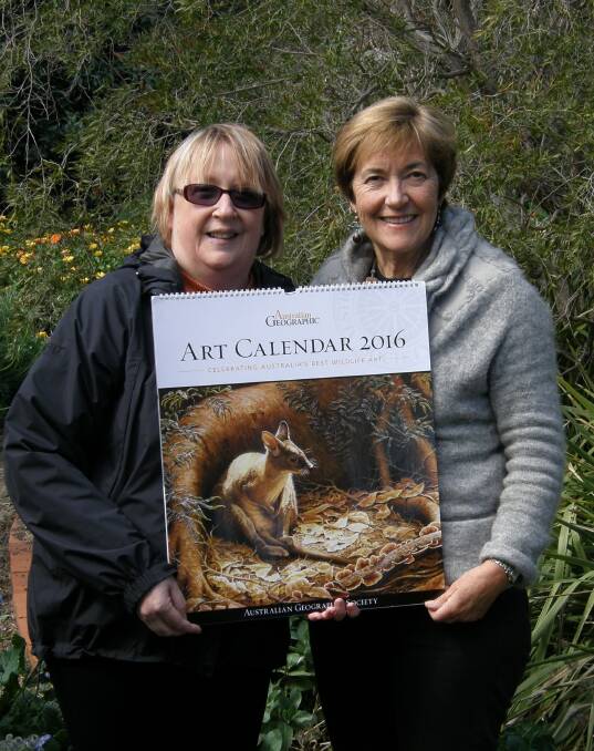 Inspiring: Cate Whitehead (WAMA Marketing) and Glenda Lewin (WAMA Patron) show off the fundraising calendar donated by the Australian Geographic Society.