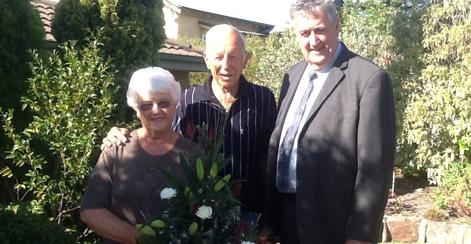 Betty and Max Howden are presented with a bouquet of flowers from Northern Grampians Shire mayor Cr Murray Emerson.