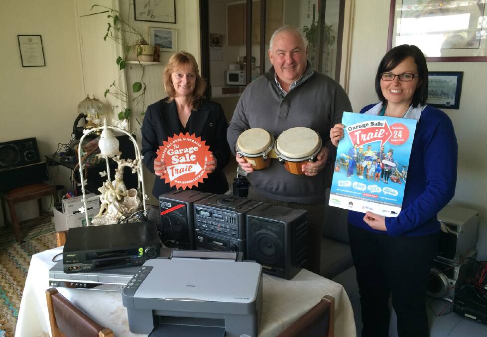 On sale: Mandy Smith, Cr Kevin Erwin and Elisha Atchison are pictured promoting the Garage Sale Trail on this Saturday in and around Stawell.