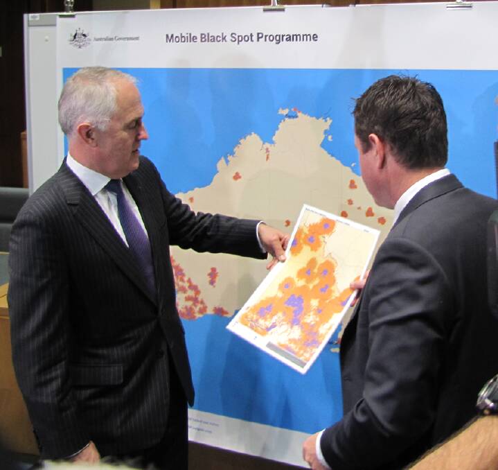 Blackspots: Member for Mallee Andrew Broad looks over a map of blackspots with Federal Communications Minister Malcolm Turnbull.
