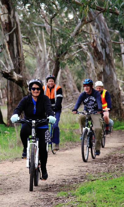 On your bike: Carolynne Johnston (right) cycles along the Grampians Rail Trail near Stawell in preparation for her Ride to Conquer Cancer in Melbourne later this year.