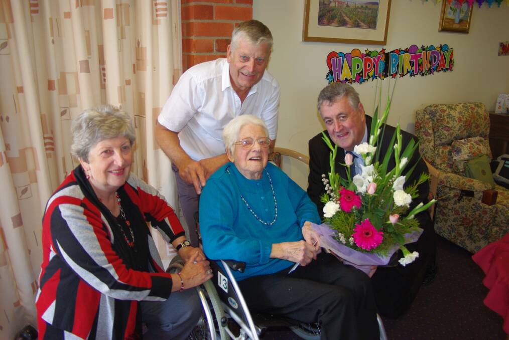 Elena Lipovas celebrates her 100th birthday with her daughter Renate, son Richard and Northern Grampians Shire Mayor Cr Murray Emerson.