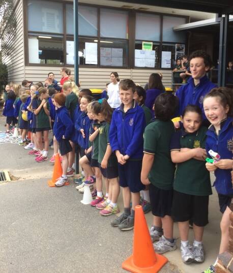 Anticipation: Students line up in anticipation as they wait to catch a glimpse inside the new portables at St Patrick's Primary School.