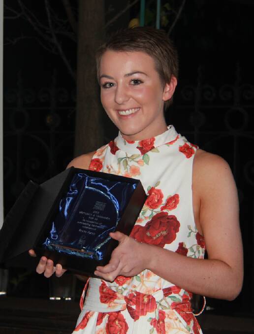 Greta Carey is pictured with her state award she received for achieving the highest fundraising across Victoria for the Leukaemia Foundation's Greatest Shave for a Cure.