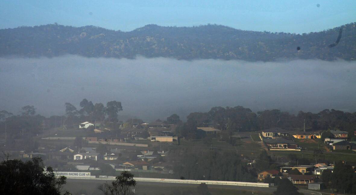 FOGGY MORNING: Thick fog sits below the Black Ranges early on Tuesday morning. The fog caused visibility problems for motorists.