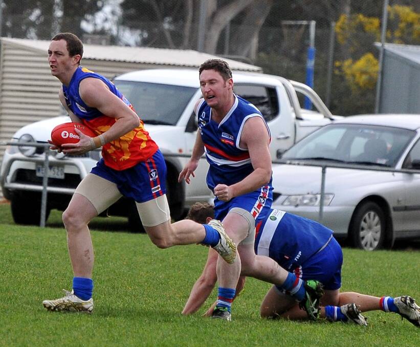 Off and running: Matt Bourke breaks out of defence. Pictures: MARK MCMILLAN