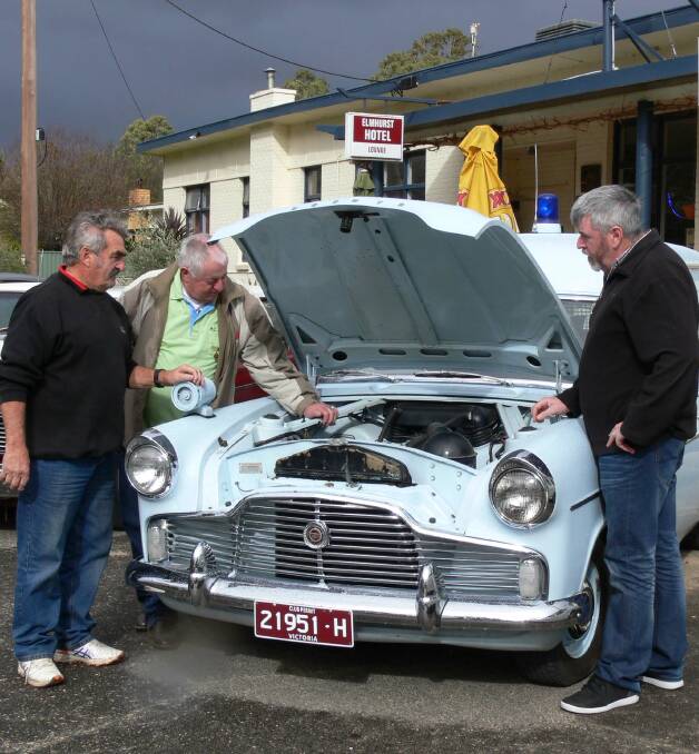 WHEELS: Ray Anderson, Barry Byron and Darren Jerram inspect Mr Anderson's 1961 Ford Zephyr Victoria Police divisional van. Picture: CONTRIBUTED
