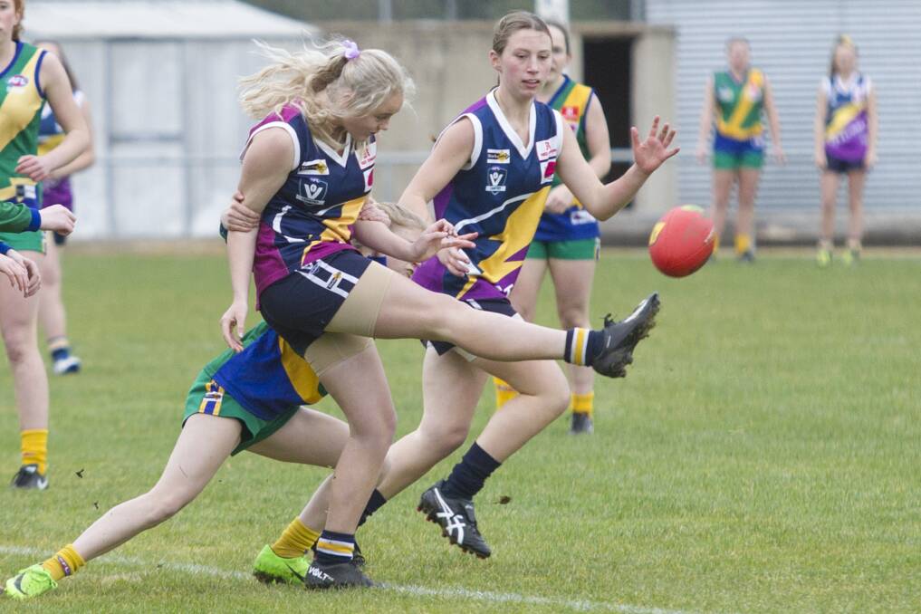 Ararat Storm's Miranda Holden gets her kick away despite pressure from a Lakers opponent earlier in the season. Picture: Peter Pickering