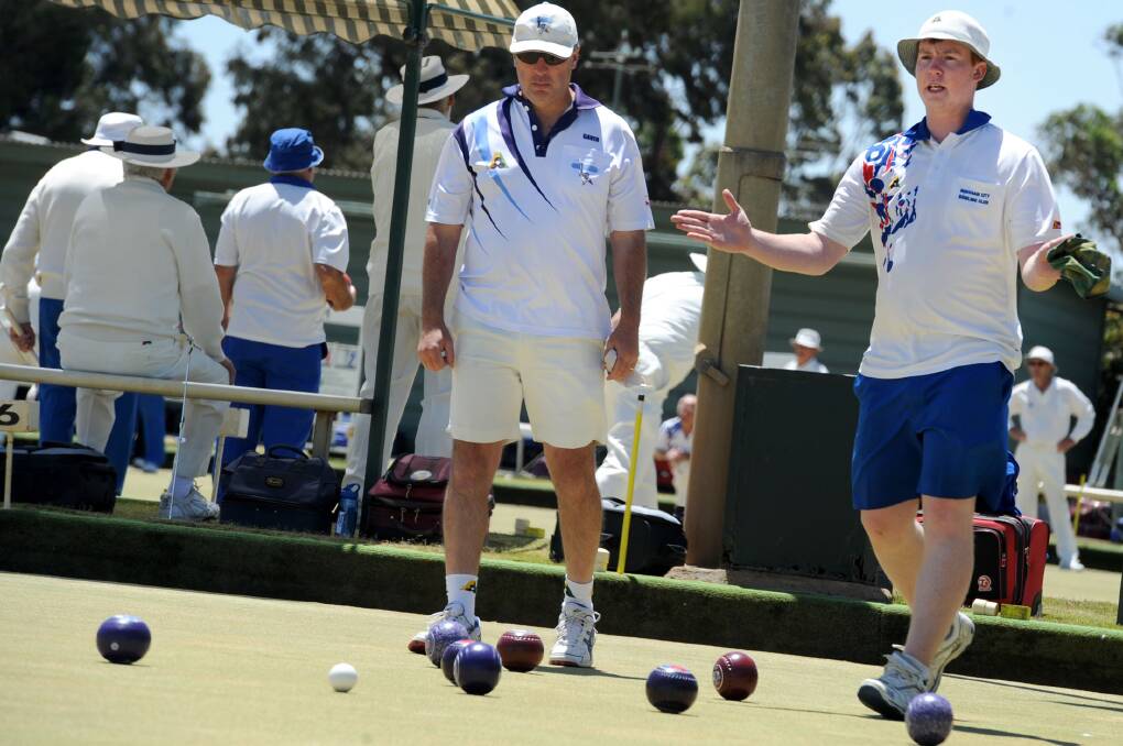 Gavin Walter of Horsham Golf watches on while Daniel Glowry of Horsham City instructs his teammate on where to bowl in the match between Horsham City one and Horsham Golf one in division one bowls. Picture: OLIVIA PAGE
