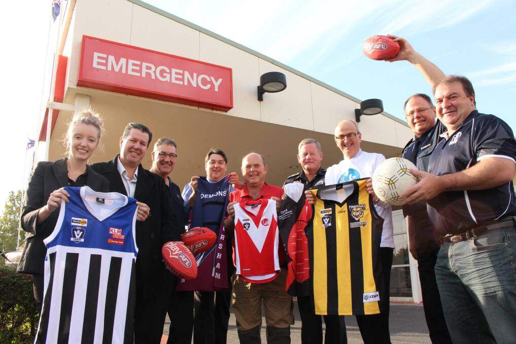 Blue Ribbon Foundation Horsham Branch members Kelly Schilling, Scott Grambau, David Scott, Geoff Lord, John Barber, Dale Russell, Don McRae and Paul Margetts get ready for the Blue Ribbon Round with AFL Wimmera Mallee general manager Steve McQueen. 