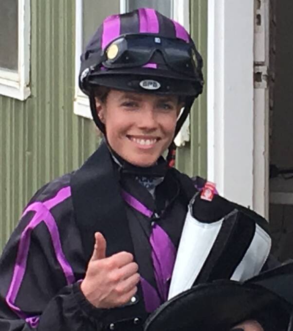 ALL SMILES: Jessica Eaton pictured in I Am The Dark's silks following a victory. I Am The Dark has qualified for a race at Flemington on Oaks Day. 