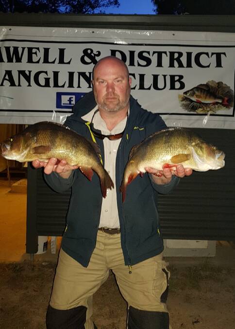 Graeme Nuske with two of his seven Lake Fyans redfin he reeled in. 