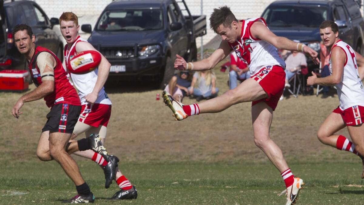 KICKING CLEAR: Alan Batchelor kicks the ball clear against Stawell in round one. Batchelor was Ararat's best in that game. Picture: Peter Pickering.
