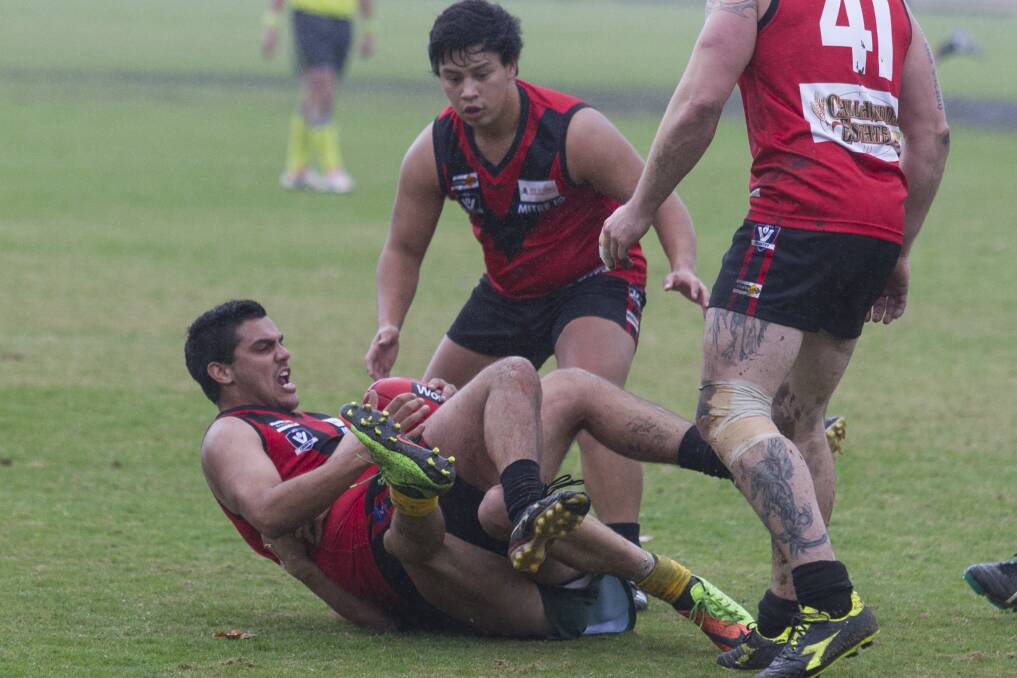 SCRAPPY: Stawell's Reserves players fight hard for the ball in wet conditions against Dimboola. Stawell faces Minyip-Murtoa this weekend. Picture: Peter Pickering.
